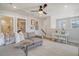 This spacious living room features a cozy sofa, a small desk, and plenty of natural light at 108 O'Leary Cir, Summerville, SC 29483