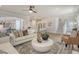 Spacious living area with staircase and a kitchen featuring counter seating, perfect for entertaining and modern living at 108 O'Leary Cir, Summerville, SC 29483