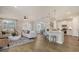 Open-concept living area features a stylish seating area, island with bar stools, and natural light at 108 O'Leary Cir, Summerville, SC 29483
