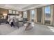 A spacious main bedroom features a king bed, sitting area, and large windows with natural light at 108 O'Leary Cir, Summerville, SC 29483