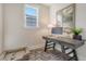 This bright office features a modern desk, computer, neutral paint and carpet and a pet bed at 108 O'Leary Cir, Summerville, SC 29483