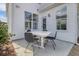 Outdoor patio area featuring a white table and four chairs, perfect for relaxing and entertaining guests at 108 O'Leary Cir, Summerville, SC 29483