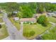 Aerial shot of a charming home with a well-kept lawn, surrounded by mature trees in a residential neighborhood at 111 Driver Ave, Summerville, SC 29483