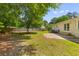 Spacious backyard featuring a well-maintained lawn, mature trees, and a privacy fence at 111 Driver Ave, Summerville, SC 29483