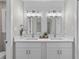 Modern bathroom with dual sinks, elegant mirrors, and stylish lighting at 111 Driver Ave, Summerville, SC 29483