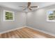 A serene bedroom featuring neutral walls, wood floors, and bright windows at 111 Driver Ave, Summerville, SC 29483