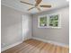 Bright bedroom featuring neutral walls, wood floors, and a ceiling fan at 111 Driver Ave, Summerville, SC 29483