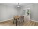 Dining room with modern light fixture and seating for four at 111 Driver Ave, Summerville, SC 29483
