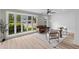 Sunlit living room with large windows, wood floors, and contemporary decor at 111 Driver Ave, Summerville, SC 29483
