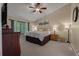 Serene bedroom features a ceiling fan, a large window, and neutral color palette at 111 Garden Hill Rd, Summerville, SC 29483