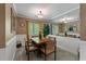 Bright dining room with a large mirror, wood table, and neutral decor at 111 Garden Hill Rd, Summerville, SC 29483