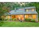 Charming two-story home featuring stone accents, mature landscaping, and a welcoming front porch at 111 Garden Hill Rd, Summerville, SC 29483