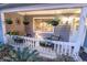 Inviting covered front porch with hanging flower baskets and cozy seating area at 111 Garden Hill Rd, Summerville, SC 29483