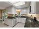 Beautifully updated kitchen with white cabinets, granite countertops, and modern appliances at 111 Garden Hill Rd, Summerville, SC 29483