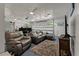Spacious living area features comfortable seating and a view of the garage door at 111 Garden Hill Rd, Summerville, SC 29483