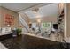 Spacious living room with stone fireplace is partially seen from kitchen at 111 Garden Hill Rd, Summerville, SC 29483