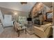 Inviting living room with a stone fireplace, plush seating, and lots of natural light at 111 Garden Hill Rd, Summerville, SC 29483