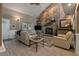 Comfortable living room features a stone fireplace and plush sofas and lots of natural light at 111 Garden Hill Rd, Summerville, SC 29483