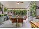 Relaxing screened porch with comfortable seating, view of the backyard, and ceiling fan at 111 Garden Hill Rd, Summerville, SC 29483