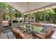 Cozy sunroom with a glass topped dining table and screened in windows, creating a relaxed atmosphere at 111 Garden Hill Rd, Summerville, SC 29483