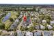Serene aerial view of a residential community with lush greenery, a golf course, and a lake at 112 Brailsford St, Charleston, SC 29492