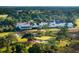 Beautiful aerial view of a golf course and country club surrounded by lush greenery and scenic landscapes at 112 Brailsford St, Charleston, SC 29492