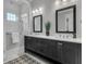 Bathroom featuring double sinks, modern fixtures, and a glass-enclosed shower at 112 Brailsford St, Charleston, SC 29492