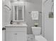Clean bathroom features a vanity with quartz countertop, framed mirror, and shower over tub at 112 Brailsford St, Charleston, SC 29492