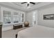 Comfortable bedroom with neutral tones, tray ceiling, and natural light from large windows at 112 Brailsford St, Charleston, SC 29492