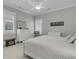 Bright bedroom with plush carpet, dresser, and natural light from the windows at 112 Brailsford St, Charleston, SC 29492