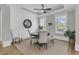 Cozy dining room with ample natural light, a round table, and shiplap accent wall at 112 Brailsford St, Charleston, SC 29492