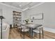 Modern dining room with hardwood floors, a rustic bookshelf, and contemporary decor at 112 Brailsford St, Charleston, SC 29492