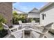 Inviting outdoor fire pit area with Adirondack chairs, perfect for gathering and relaxation at 112 Brailsford St, Charleston, SC 29492
