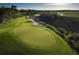 A pristine community golf course is nestled in a marshy landscape under a blue sky at 112 Brailsford St, Charleston, SC 29492