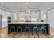 Well-lit kitchen with a large island, modern fixtures, and stainless steel appliances at 112 Brailsford St, Charleston, SC 29492