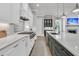 Modern kitchen with stainless steel appliances, quartz countertops, and an island with seating at 112 Brailsford St, Charleston, SC 29492