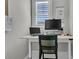Home office space featuring a modern desk setup with a laptop, monitor, and storage at 112 Brailsford St, Charleston, SC 29492