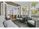 Inviting sunroom with wicker furniture, neutral tones, and access to the outdoors at 112 Brailsford St, Charleston, SC 29492