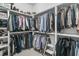 Organized walk-in closet with ample storage space and built-in shelving for clothes and accessories at 112 Brailsford St, Charleston, SC 29492