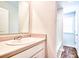 Bathroom featuring a vanity with a sink and a walk-in shower down the hall at 115 E East Sunrise Lane, Summerville, SC 29486