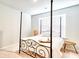 This bedroom features a modern bed frame, bright window, and sleek side table at 115 E East Sunrise Lane, Summerville, SC 29486
