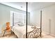 This bedroom features a modern bed frame, bright window, and sleek side table at 115 E East Sunrise Lane, Summerville, SC 29486