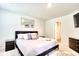 Relaxing bedroom with plush carpet, a large mirror, and neutral decor, creating a serene space at 115 E East Sunrise Lane, Summerville, SC 29486
