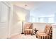 Upstairs sitting area with stylish chairs and ambient lighting near a staircase at 115 E East Sunrise Lane, Summerville, SC 29486