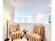 Upstairs sitting area with stylish chairs and ambient lighting at 115 E East Sunrise Lane, Summerville, SC 29486
