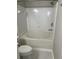 Bathroom features a white tub with tile surround, a white toilet, and tiled floors at 1300 Park West Blvd # 516, Mount Pleasant, SC 29466
