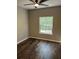 A bedroom featuring a hardwood floor, a ceiling fan, and a window that provides natural light at 1300 Park West Blvd # 516, Mount Pleasant, SC 29466
