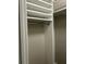 Open closet with shelving above a chrome bar for hanging clothes to maximize storage space at 1300 Park West Blvd # 516, Mount Pleasant, SC 29466