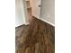 A view of the hardwood floor in a home, showing a doorway to another room at 1300 Park West Blvd # 516, Mount Pleasant, SC 29466