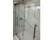 Glass enclosed shower with white marble tile and modern fixtures at 1300 Park West Blvd # 516, Mount Pleasant, SC 29466